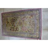 A very good quality hand knotted Kum Arbachani silk rug, 170cm x 106cm - in excellent condition