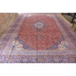 A hand knotted woollen Kashan rug, approx 470cm x 341cm - in good condition