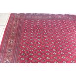 A hand knotted woollen turkman rug - 388cm x 308cm