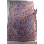 A hand knotted woollen rug, 172cm x 107cm - some usage wear, mainly to ends