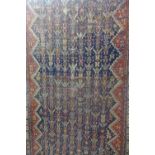 A large hand knotted woollen runner, approximately 510cm x 141cm - with general wear and repaired