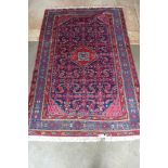 A hand knotted woollen Antique Malayer rug - 202cm x 132cm