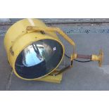 A very large Harley Aircraft Landing Light type FM- serial no 9991- yellow painted aluminium raising