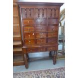 An American style mahogany chest on stand with 15 small drawers, 174cm tall x 103cm x 52cm