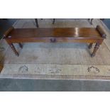 A Victorian mahogany window seat on turned legs, 44cm tall, 135cm x 28cm