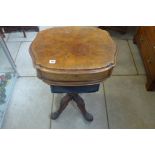 A Victorian walnut work box with a fitted drawer above a basket on a carved quatrefoil base, 75cm