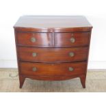 A 19th century mahogany bow fronted oak lined chest of two over two drawers, on splayed bracket