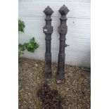 A pair of cast iron Victorian posts and a heavy metal chain