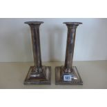 A pair of weighted silver candlesticks, 23cm high, in good condition for their age apart from a dam