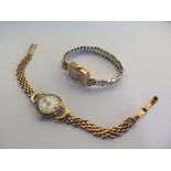 A ladies manual wind 9ct gold wristwatch on a 9ct gold strap, approx 14 grams, working - and a 9ct