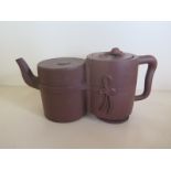 A Chinese red ware double cylinder teapot, with Chinese character mark to lid interior, approx 10.