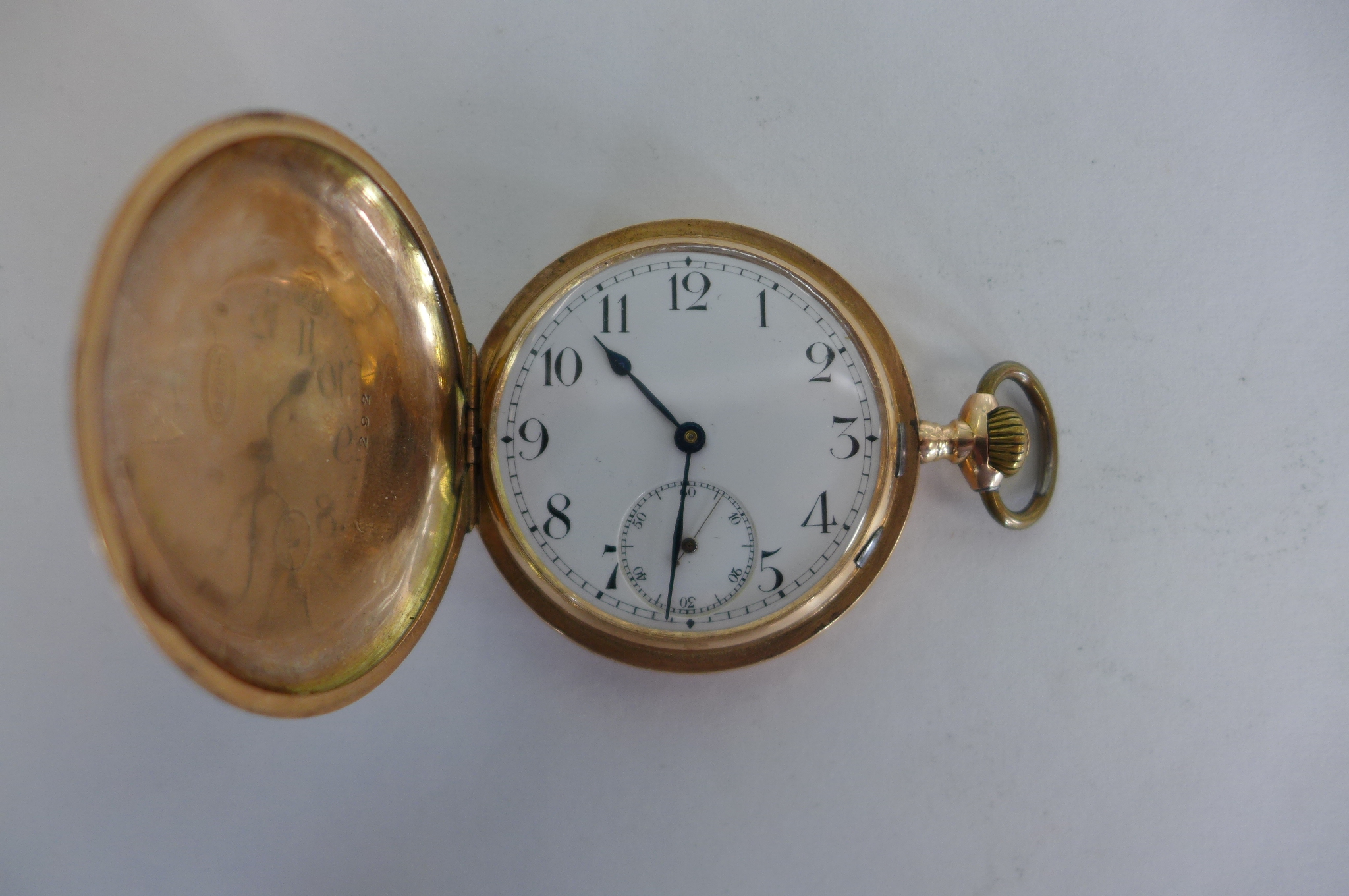 A 14ct yellow gold Hunter pocket watch, 5cm wide with base metal dust cover, approx 80 grams -