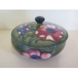 A Moorcroft clematis decorated lidded bowl, 14cm in diameter -overall crazing but generally good