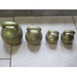 Four brass imperial ball weights, each with single loop handles, three Georgian, with 56lb , 28lb