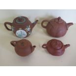 Four red ware teapots of different sizes, one with Chinese character marks, largest approx 10.5cm