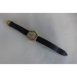 A 9ct gold gents Longines manual wind wristwatch, signed to movement, 35mm wide including button,