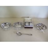 Three silver pin dishes and a pair of silver napkin rings, engraved with 'C' initial, approx 6.1