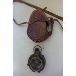 A WWI officers compass, by E R Watts and Son, London, no 940 dated 1915 with Military Mark, with a