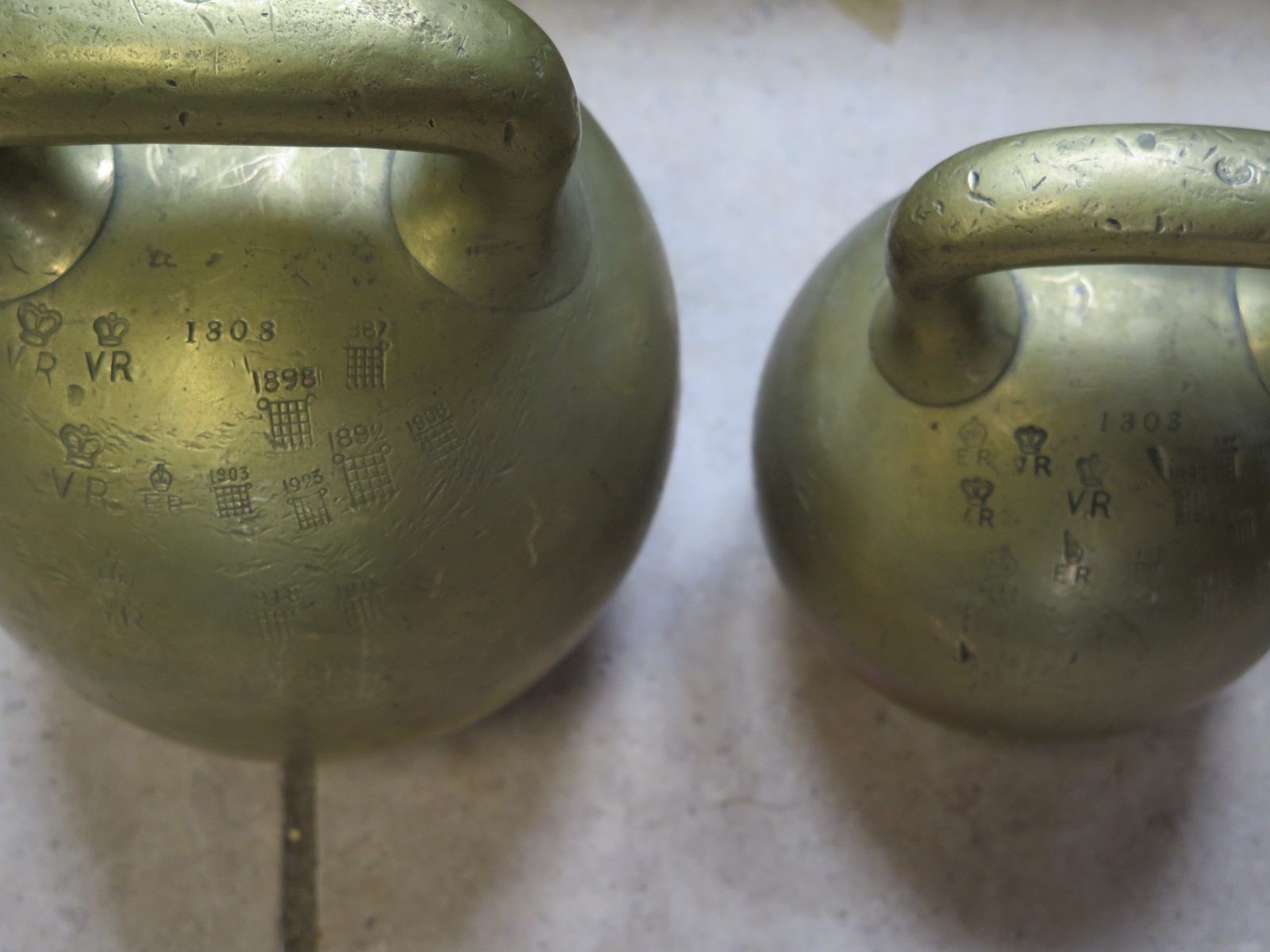 Four brass imperial ball weights, each with single loop handles, three Georgian, with 56lb , 28lb - Image 2 of 3