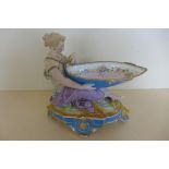 A 19th century porcelain figural sweet meat dish, 21cm tall - no obvious repairs or damage