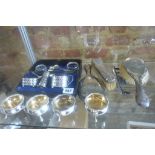 A collection of silver items, a cased condiment set and four salts, five salt spoons and four silver