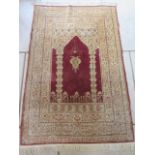 A very fine hand knotted Hereke, silk prayer rug, gold threaded weft, estimate age 100yrs - size