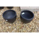 A pair of black slate planters, 28cm high