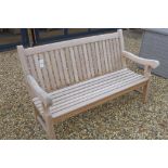 A teak heavy duty weathered garden bench, 152cm wide