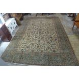 A hand knotted woollen Kashan rug, 385cm x 265cm - in generally good condition
