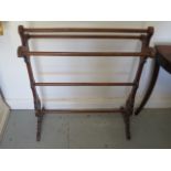 A Victorian walnut towel rail