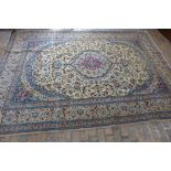 A hand knotted woollen fine Nain silk inlaid rug, 345cm x 251cm - some wear and signs of repair,