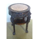 A 19th century early 20th century Chinese carved hardwood jardiniere stand with a marble top, and an