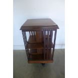 A walnut revolving bookcase, 86cm high