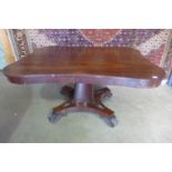A William IV serpentine rosewood breakfast centre table on a quadroform base, approx 139cm x