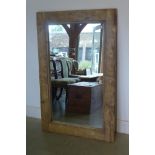 A rustic pine framed mirror, 84cm x 130cm