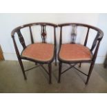 Two Edwardian mahogany and inlaid corner chairs