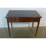 An Edwardian mahogany two drawer side table with a leather inset top, 71cm tall x 92cm x 55cm