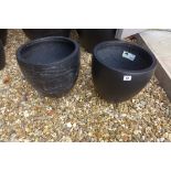 A pair of black slate effect planters, 31cm high