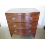 A 19th century mahogany three drawer bow fronted chest of small proportions, 77cm tall x 43cm - in