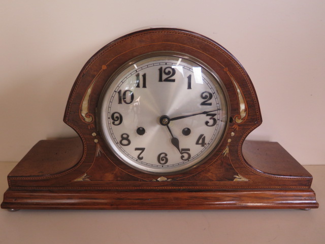 An inlaid mahogany striking mantle clock, 43cm wide, running