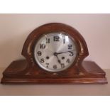 An inlaid mahogany striking mantle clock, 43cm wide, running