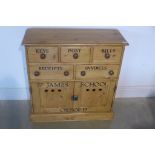 A pine storage chest with three drawers and two cupboard doors, 81cm tall x 77cm x 30cm