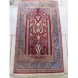 A very fine, hand knotted Hereke, silk rug, gold threaded weft - estimate age 100 yrs - 135cm x 77cm