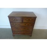 A small Georgian mahogany chest with two short over three long drawers, oak drawer lining, pine