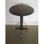 A Victorian rosewood circular top lamp table with brass and enamel marquetry insets to the top,