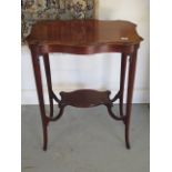 An Edwardian mahogany side table with a shaped top and under tier, 72cm tall x 61cm x 41cm