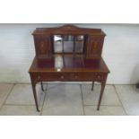 An Edwardian inlaid mahogany bonheur du jour writing desk with drawers stamped TREVOR PAGE and CO