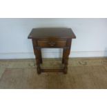 A modern oak antique style single drawer side table - 72cm tall x 61cm x 35cm