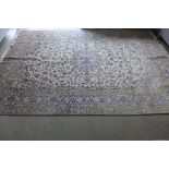 A hand knotted woollen Kashan rug, 300cm x 200cm - generally good, some colour fading