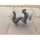 A rooster and hen bronze garden figures, 47cm tall
